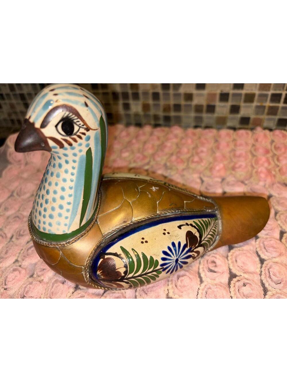 This is a vintage Mexican Tonala ceramic, brass, and copper duck figurine.